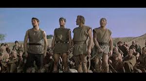 I am Spartacus scene — slaves standing up one by one to claim the identity